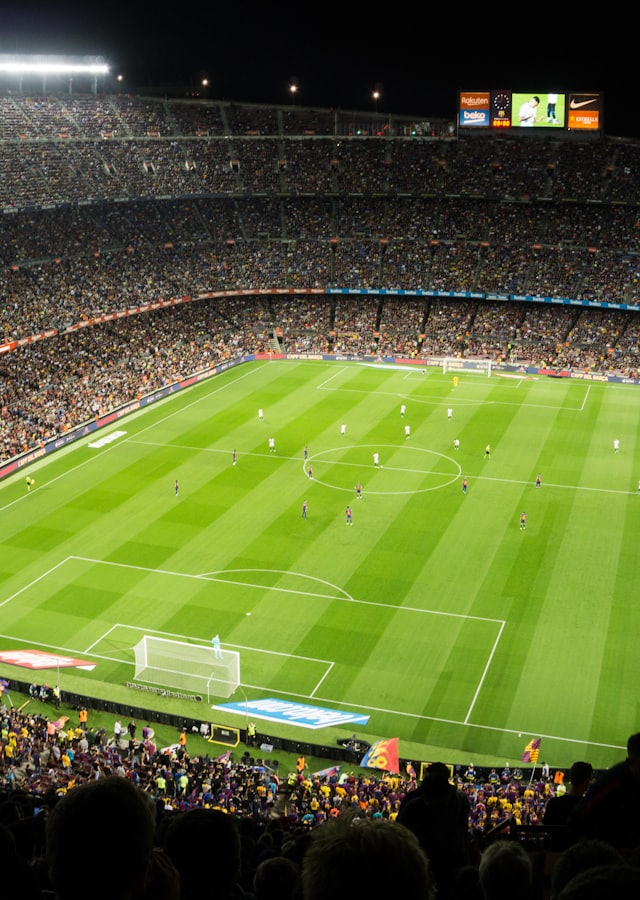 Packed football stadium at night — live sports on PrimeFlex Media